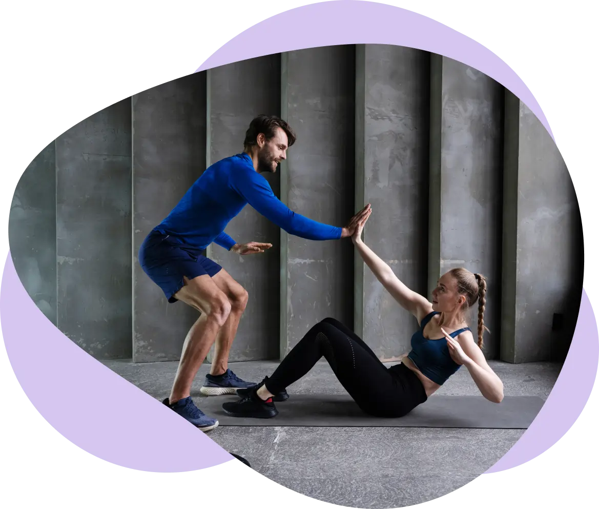 Whitney leaning against a railing on a downtown street