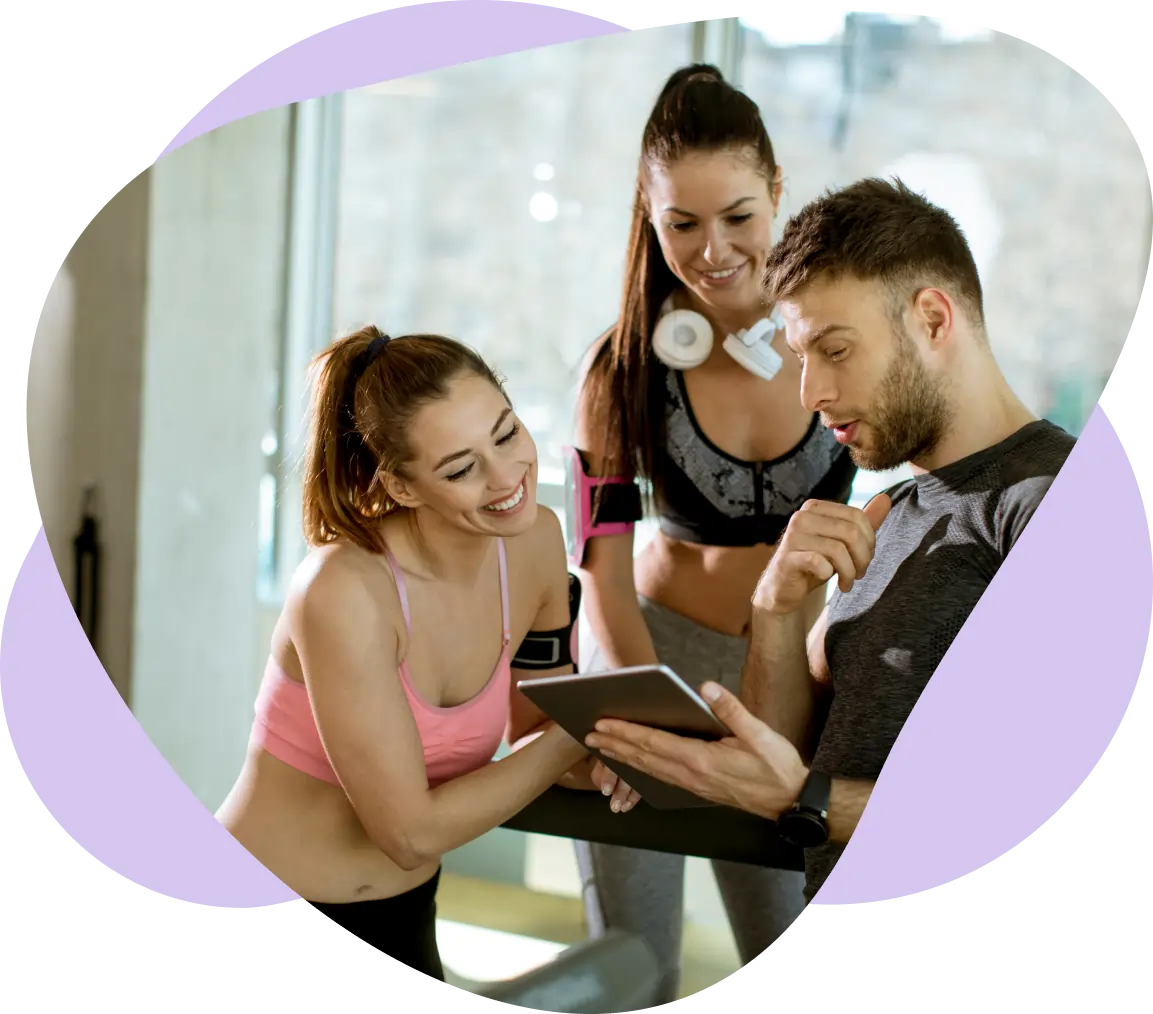 Whitney leaning against a railing on a downtown street